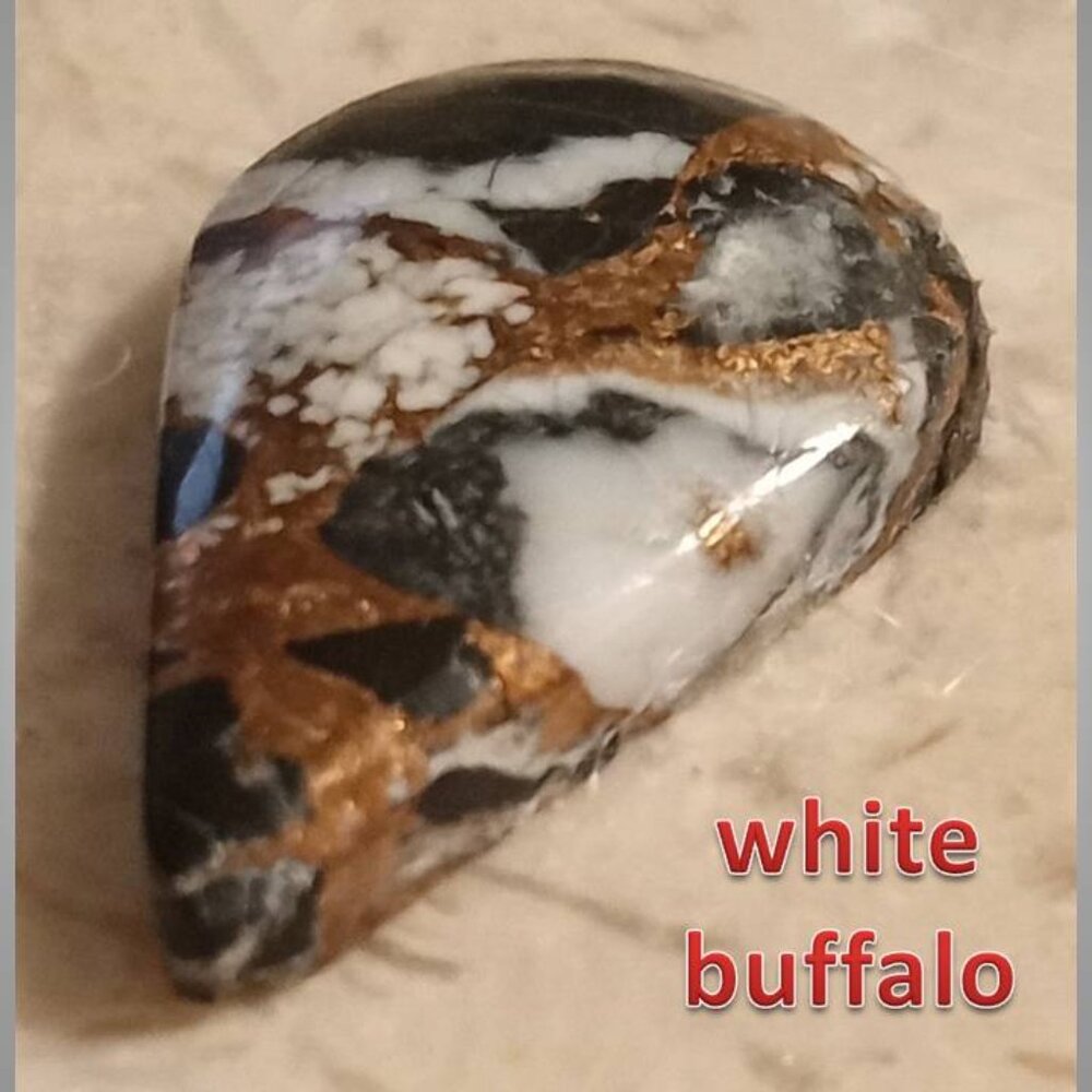 WHITE BUFFALO w/bronze cab RARE 6.5ct